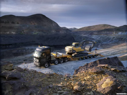HD desktop wallpaper showcasing a Volvo excavator loaded on a heavy-duty truck in a rugged, mountainous quarry setting.
