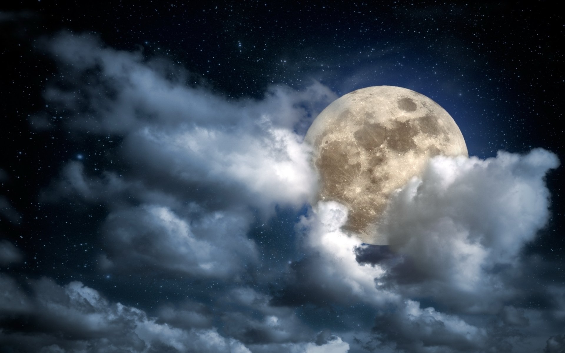 HD nature wallpaper showing a bright full moon partially veiled by clouds against a starry night sky, designed for PC desktop backgrounds.