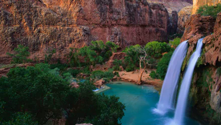 HD PC desktop wallpaper featuring Havasu Falls cascading into a turquoise pool surrounded by lush greenery and rocky canyon walls.