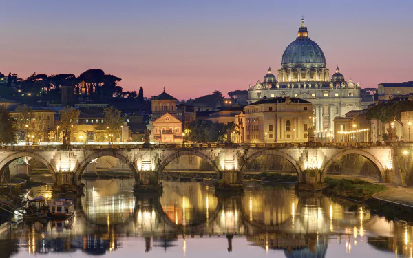 A stunning HD wallpaper showcasing the illuminated skyline of Rome, featuring iconic architecture and the tranquil reflection on the river at dusk.