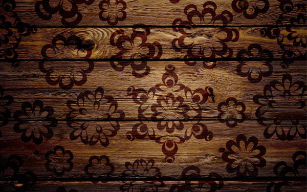 Artistic HD wallpaper featuring a wooden background adorned with intricate floral patterns, blending natural texture with creative design.