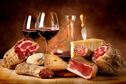 A 4K Ultra HD still life desktop wallpaper featuring assorted cured meats, bread, a wedge of cheese, and glasses of red wine on a wooden surface with a warm brown background.
