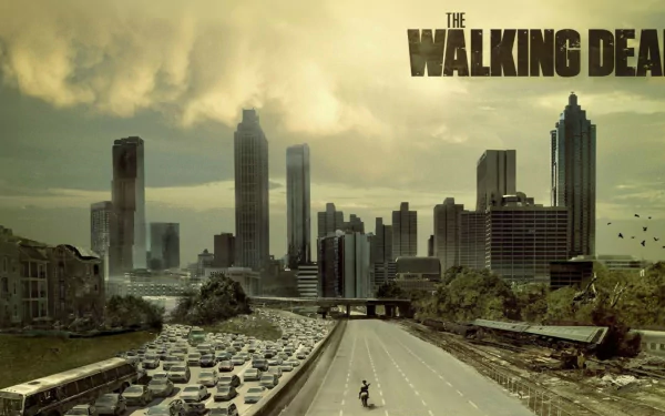 HD desktop wallpaper featuring a desolate cityscape from The Walking Dead, showcasing abandoned vehicles on a highway and a dark, atmospheric skyline.