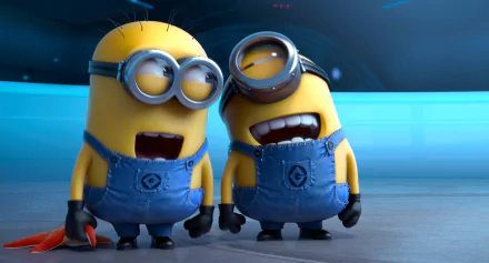 HD desktop wallpaper featuring two Minions from Despicable Me 2, with one laughing and the other smiling, set against a sleek blue background.