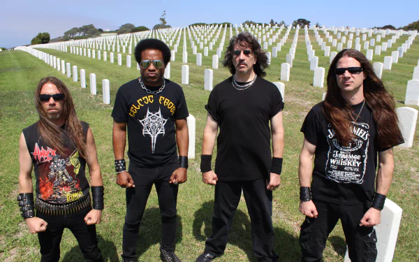 Four long-haired metal band members stand among rows of white graveyard headstones; high‑res 5K desktop wallpaper channeling the styles of Venom, Metallica, Overkill and Hirax.