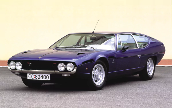 HD PC desktop wallpaper of a classic purple Lamborghini Espada, showcasing the vintage vehicle's sleek design against a plain background.
