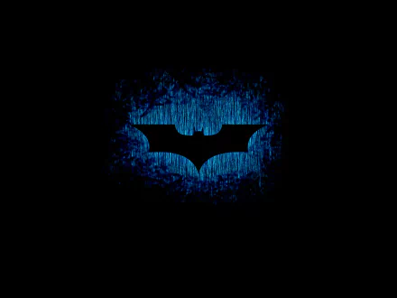 HD desktop wallpaper featuring the Batman symbol, with a dark background accentuated by a textured blue glow highlighting the iconic emblem.