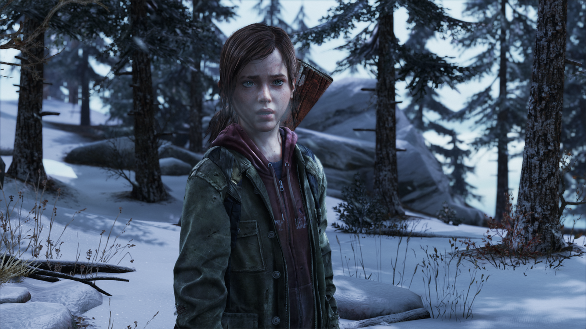 A high-definition desktop wallpaper featuring a character from the video game The Last of Us, set in a snowy forest environment with trees and rocky terrain.