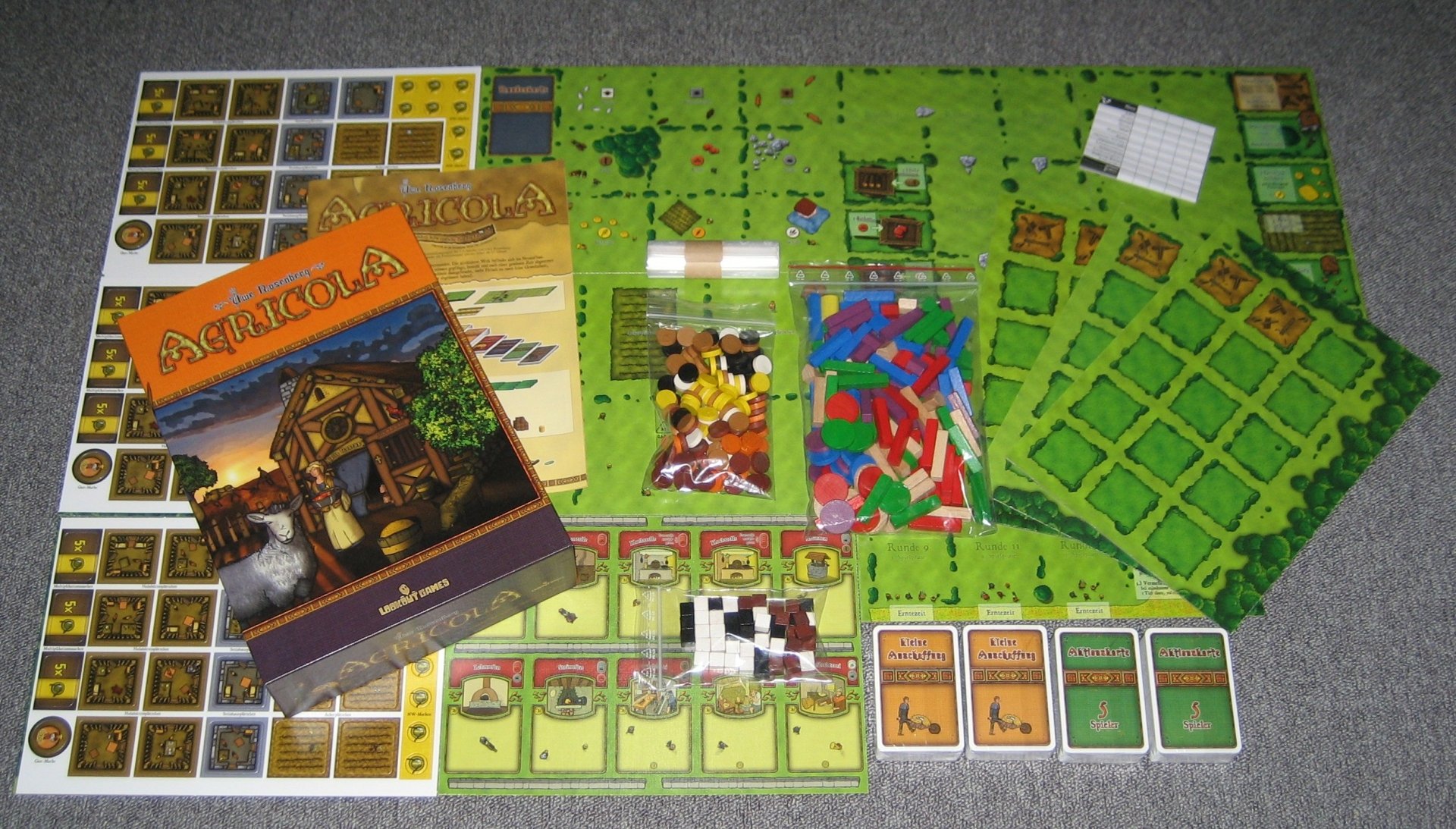 HD desktop wallpaper featuring the board game Agricola, with its components and colorful board fully displayed.