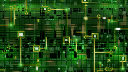 HD desktop wallpaper showcasing a detailed green circuit board design with glowing pathways, embodying technology and electronic connectivity.