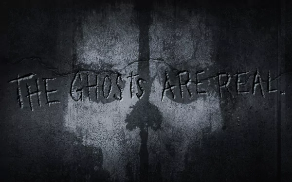 HD desktop wallpaper for the video game Call of Duty: Ghosts, featuring a dark, cracked wall with a ghostly mask and the phrase THE GHOSTS ARE REAL etched into the surface.