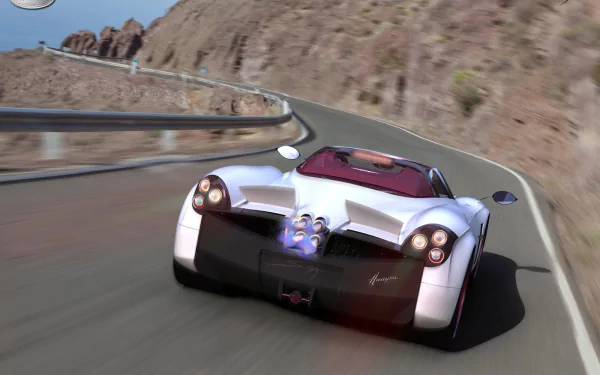 HD PC desktop wallpaper featuring a white Pagani Huayra driving on a winding mountain road, capturing dynamic motion and sleek vehicle design.