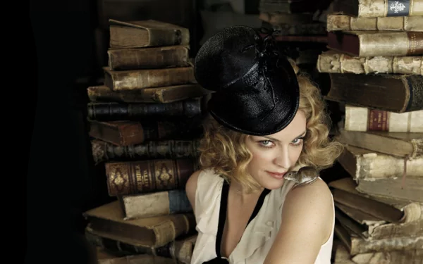 HD PC desktop wallpaper featuring Madonna in vintage attire, surrounded by stacks of old books, blending music and classic style.