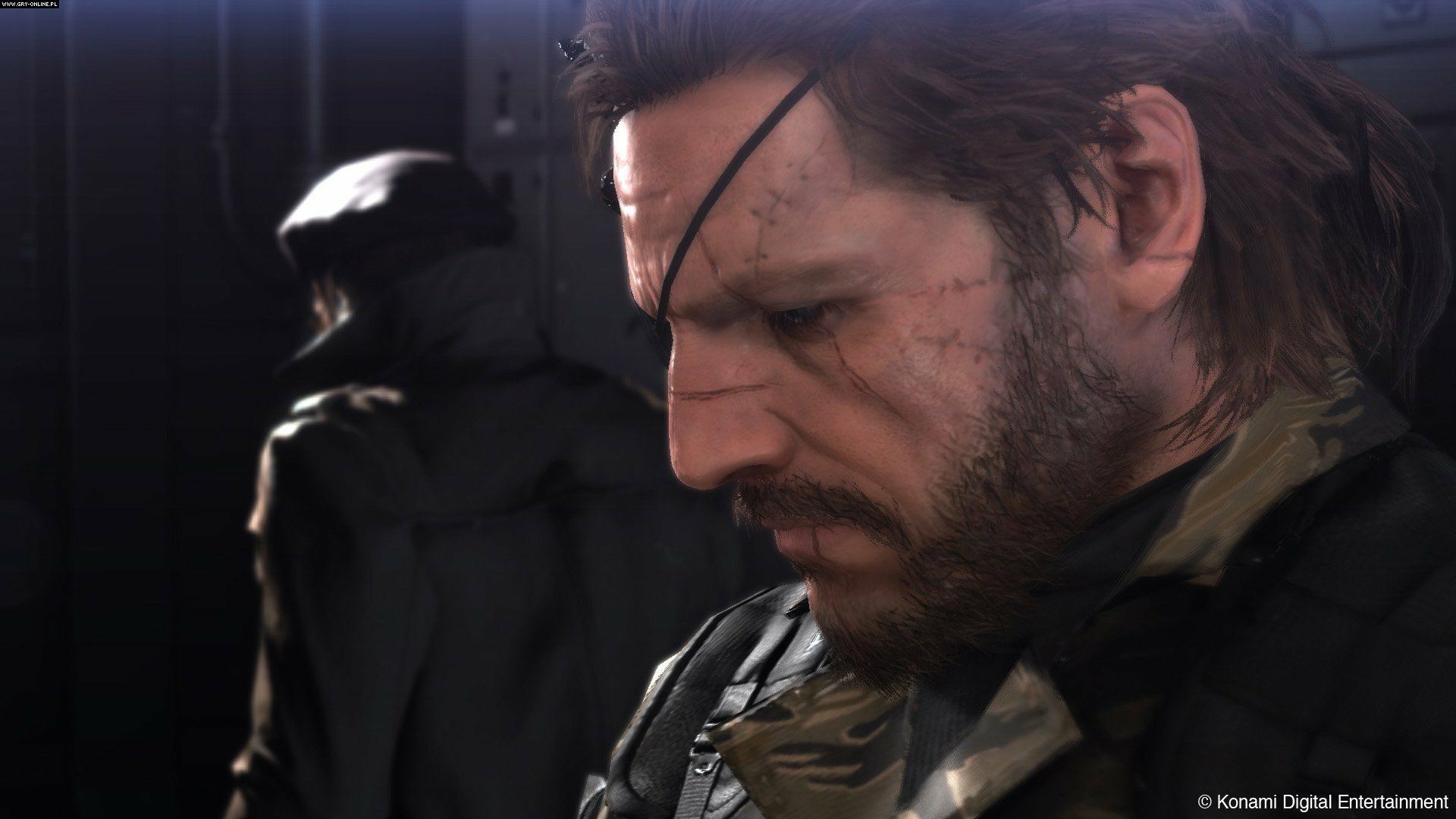 HD PC desktop wallpaper featuring a close-up of the protagonist from Metal Gear Solid V: The Phantom Pain, showcasing detailed facial textures and a dark, intense atmosphere.