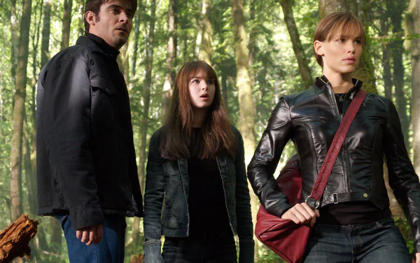 HD PC desktop wallpaper featuring a scene from the movie Elektra, with three characters standing in a forest setting, dressed in dark clothing.
