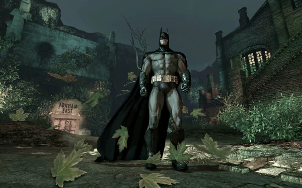 Batman stands heroically amid the dark, ruined grounds of Arkham Asylum in this 4K Ultra HD desktop wallpaper from the video game Batman: Arkham Asylum.