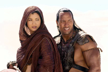 HD desktop wallpaper featuring Dwayne Johnson and Kelly Hu from the movie The Scorpion King, showcasing their iconic characters in a desert setting.
