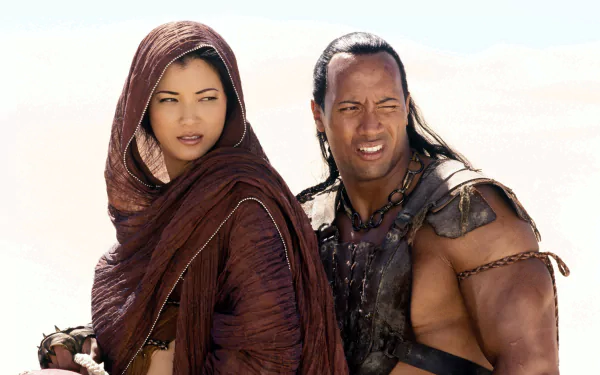 HD desktop wallpaper featuring Dwayne Johnson and Kelly Hu from the movie The Scorpion King, showcasing their iconic characters in a desert setting.