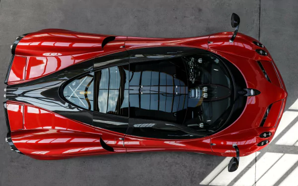 Top-down view of a red sports car from Forza Motorsport 5, featured as an HD PC desktop wallpaper and background.