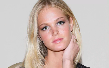 HD PC desktop wallpaper featuring a close-up portrait of celebrity Erin Heatherton with a neutral expression and light background.