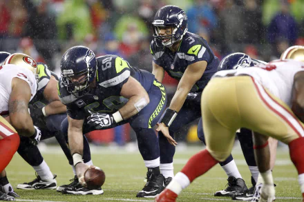 Russell Wilson in action during a Seattle Seahawks game, showcasing the intensity of sports in Seattle, captured in stunning 4K Ultra HD detail.