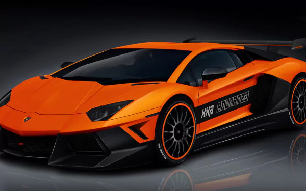 A striking Lamborghini Aventador in vibrant orange, showcasing sleek lines and modern design. This HD image serves as a stunning desktop wallpaper and background.