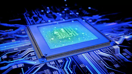 HD wallpaper featuring a close-up of a CPU integrated into a glowing blue circuit board, emphasizing advanced technology and computer engineering.