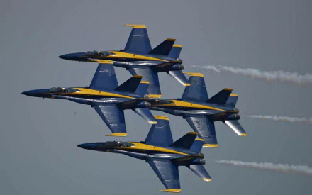 Four military jets flying in tight formation during an air show, captured in sharp detail as an HD PC desktop wallpaper background.