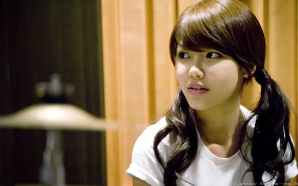 HD desktop wallpaper featuring Sooyoung, South Korean actress, dancer, and singer from Girls' Generation (SNSD), captured in a warm indoor setting.
