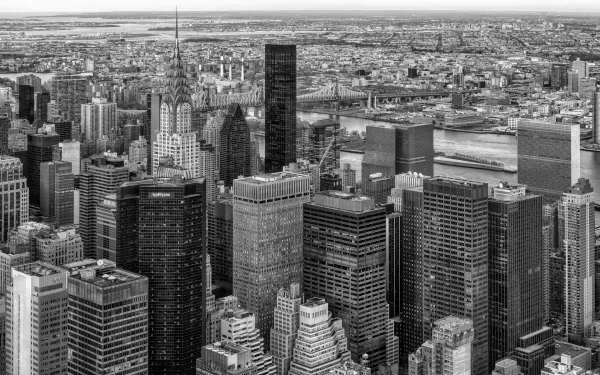 Black and white HD desktop wallpaper featuring the Queensboro Bridge and Manhattan skyline, showcasing iconic man-made structures in New York City.