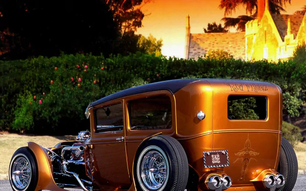 A stunning hot rod vehicle with a sleek design, set against a picturesque background at sunset, serves as an eye-catching HD PC desktop wallpaper.