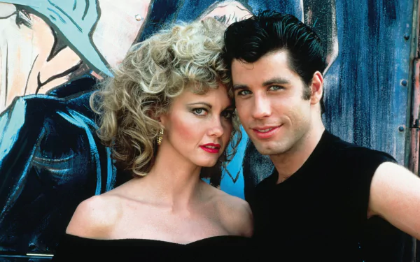 HD desktop wallpaper featuring iconic characters from the movie Grease, showcasing classic 1950s style and charm.