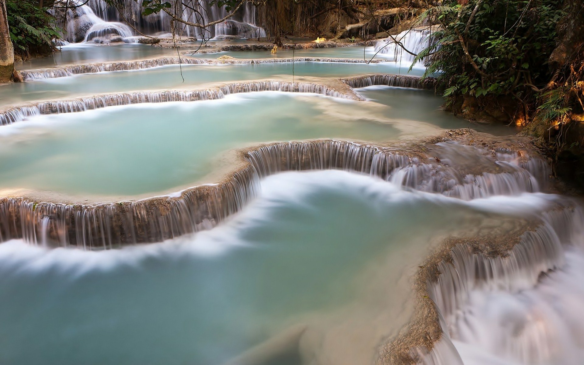 HD PC desktop wallpaper and background: nature waterfall with turquoise terraced pools cascading over limestone ledges beneath lush green foliage.