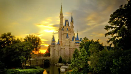 HD wallpaper of Disney World's iconic castle at sunset, surrounded by lush greenery and a serene moat.