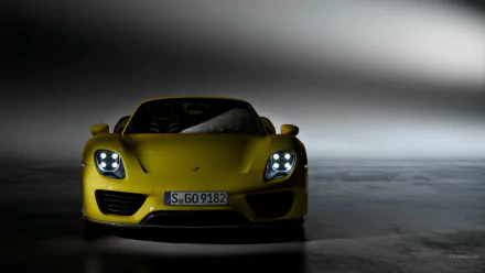 Yellow Porsche 918 Spyder vehicle, front view in low light on a reflective floor — HD PC desktop wallpaper and background.