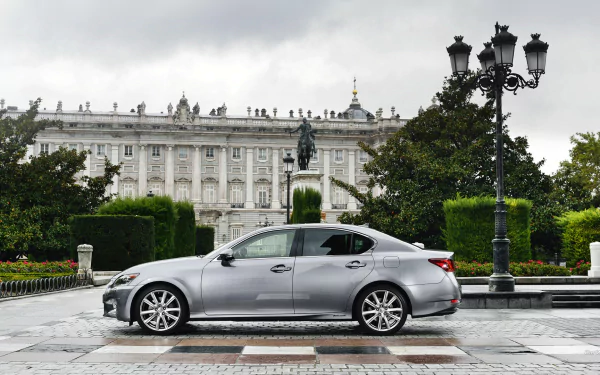 Side view of a silver Lexus GS 300h parked in front of an ornate historic building, featured as an HD PC desktop wallpaper and background.