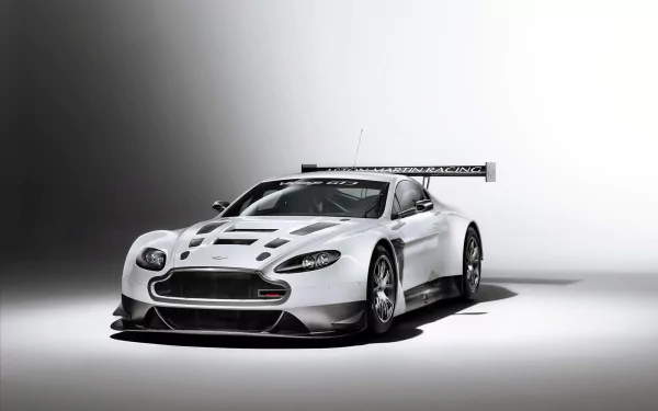 White Aston Martin V12 Vantage race vehicle on a minimalist studio backdrop, HD PC desktop wallpaper/background.