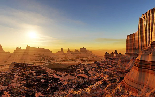 A stunning HD wallpaper of the Grand Canyon at sunset, showcasing layered rock formations and vast desert landscapes bathed in warm sunlight, highlighting the beauty of nature.