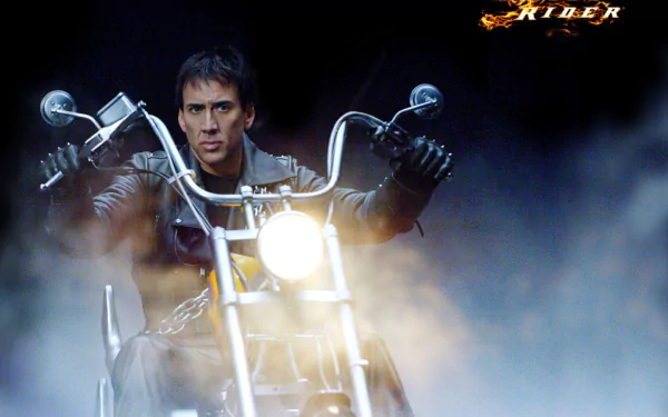 Nicolas Cage as Johnny Blaze in this dynamic HD wallpaper from the movie Ghost Rider. The image showcases him riding a motorcycle amidst swirling smoke.