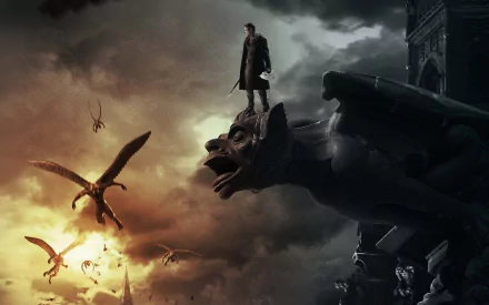 A dramatic HD PC desktop wallpaper featuring a figure standing on a gargoyle, surrounded by dark clouds and soaring creatures, inspired by the movie I, Frankenstein.