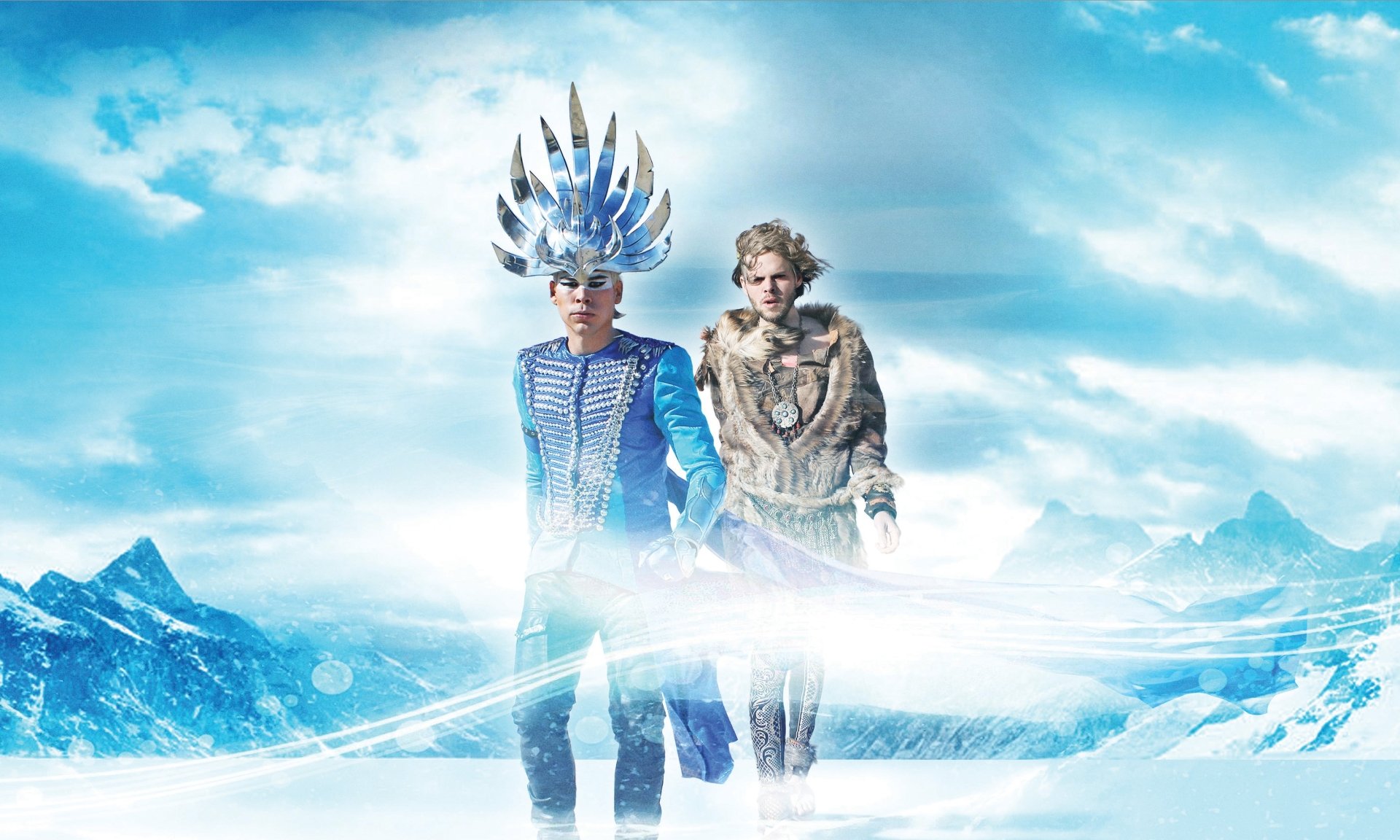 2K Quad HD PC desktop wallpaper background: two surreal, costumed figures in an icy, futuristic landscape — music art inspired by Empire Of The Sun.