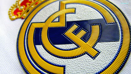 HD wallpaper featuring the Real Madrid C.F. logo, displaying the iconic crest in vivid detail.