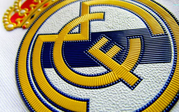 HD wallpaper featuring the Real Madrid C.F. logo, displaying the iconic crest in vivid detail.