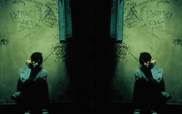 HD PC desktop wallpaper featuring a dark, mirrored image from the movie Requiem For A Dream, showing a person sitting against a graffiti-covered wall in a moody setting.