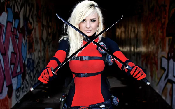 A confident woman in vibrant red and black cosplay holds two swords crossed in front of her, set against a colorful graffiti background. This high-definition image serves as a striking desktop wallpaper.