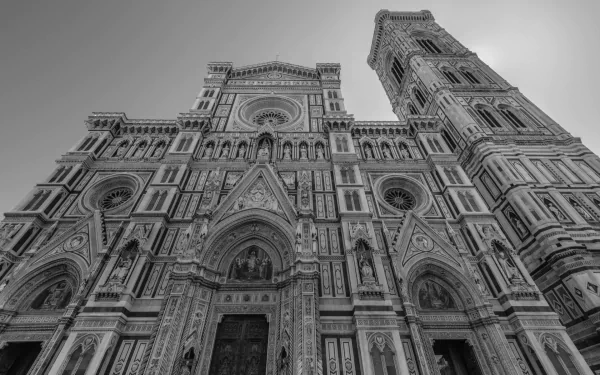 HD PC desktop wallpaper: dramatic low-angle black-and-white view of the Basilica of Saint Mary of the Flower's ornate facade and bell tower, religious architecture.