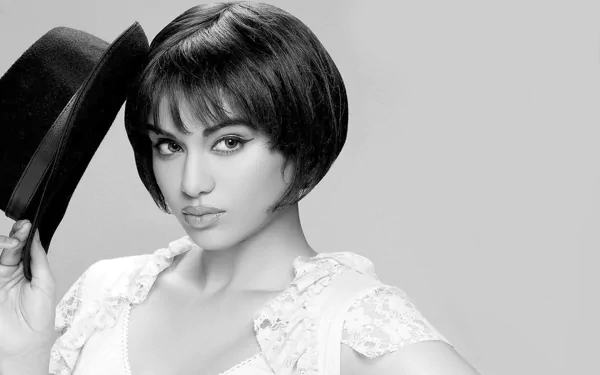 Adah Sharma poses confidently in a stylish black and white portrait, wearing a hat. This image serves as a striking HD desktop wallpaper and background.