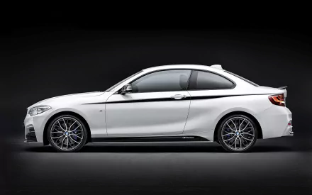 White BMW 2 Series coupe side profile on a dark studio backdrop — BMW vehicle 2K Quad HD PC desktop wallpaper and background.