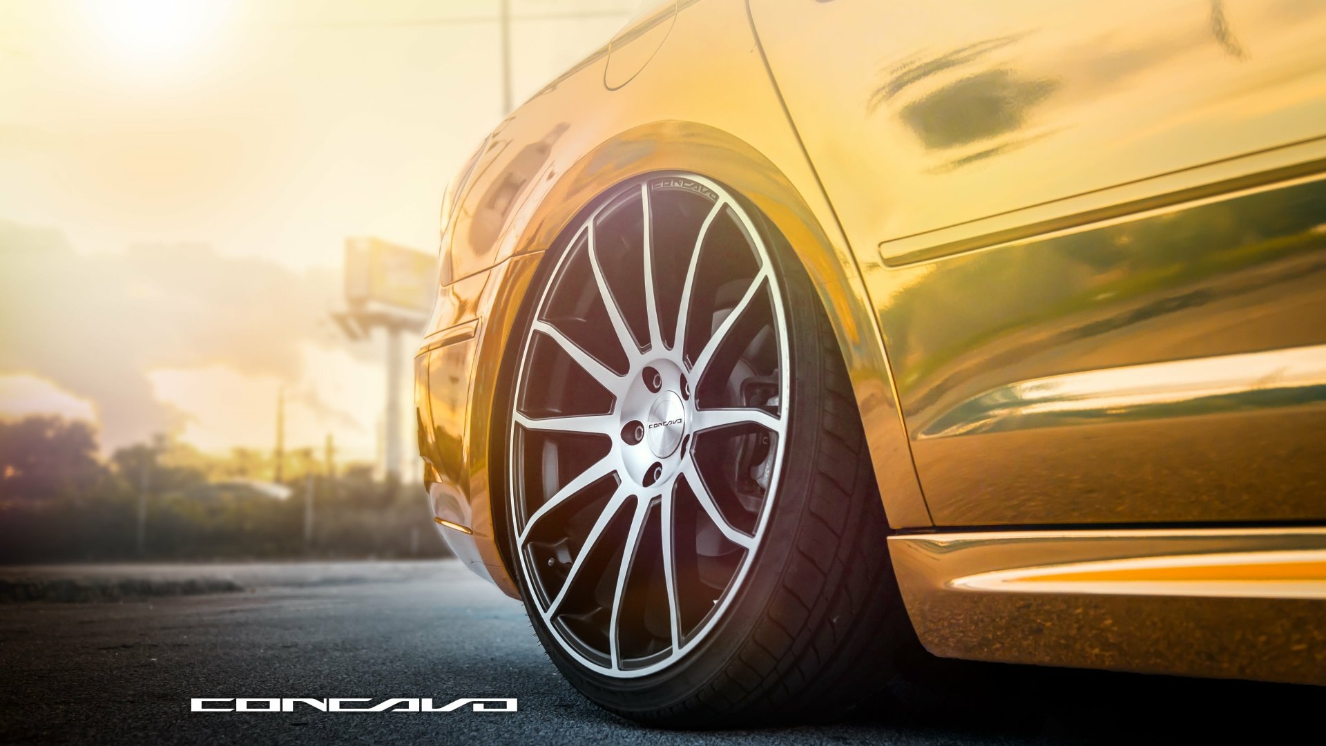Golden Volkswagen CC close-up of wheel and side panel at sunset — 4K Ultra HD PC desktop wallpaper of a Volkswagen vehicle.