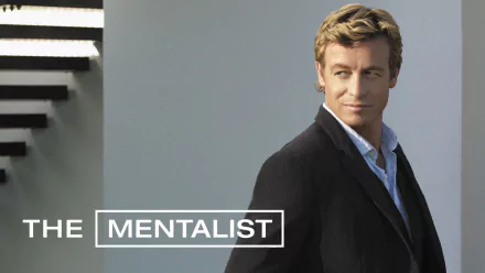 HD desktop wallpaper featuring Simon Baker as Patrick Jane from the TV show The Mentalist, with the show’s title displayed in white text on a gray background.